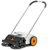 Vista laterale della spazzatrice STIHL KG 550 in azione su un vialetto di cemento